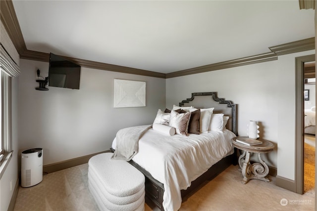 carpeted bedroom with ornamental molding