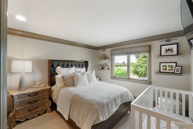 carpeted bedroom with crown molding