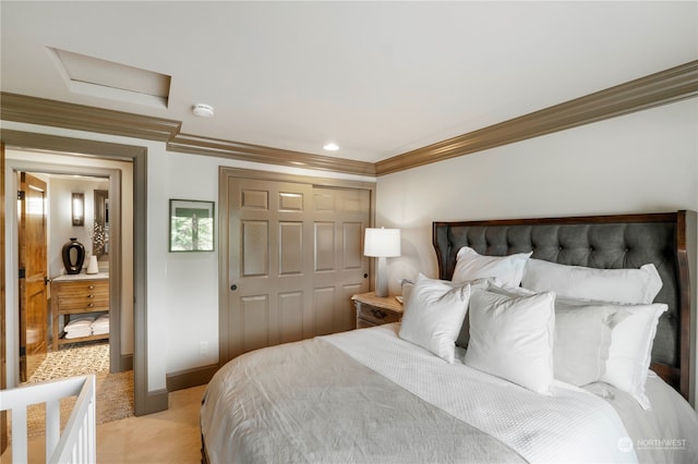 carpeted bedroom featuring ornamental molding and a closet