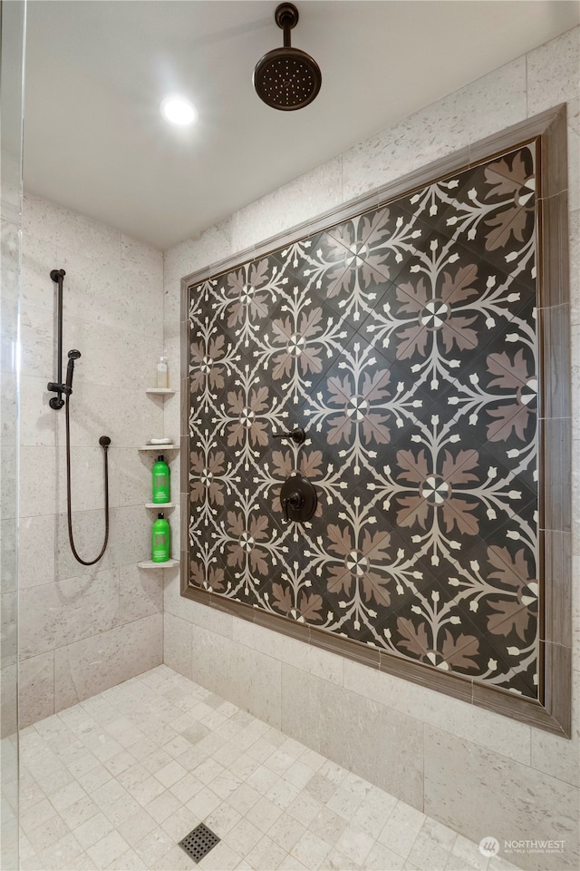 bathroom with a tile shower