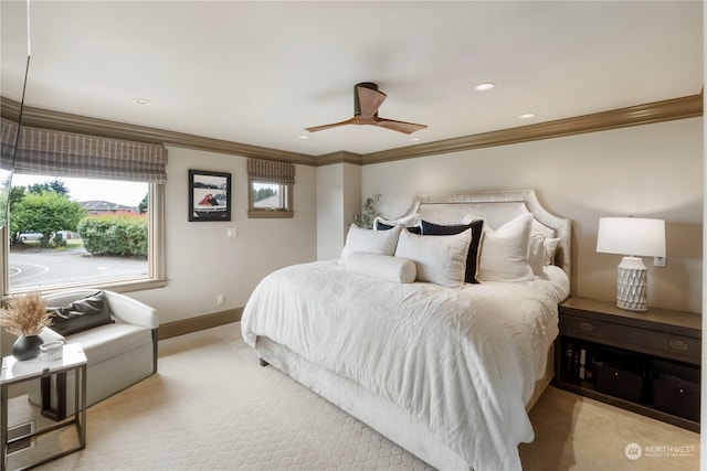 carpeted bedroom featuring crown molding and ceiling fan