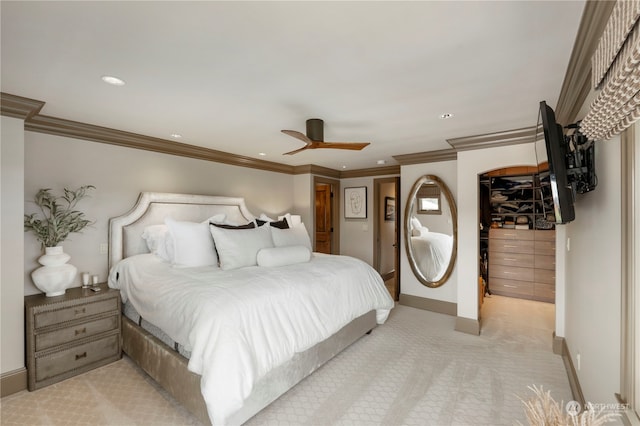 bedroom featuring ceiling fan, light colored carpet, and ornamental molding