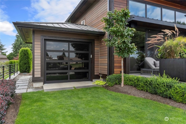 doorway to property featuring a yard