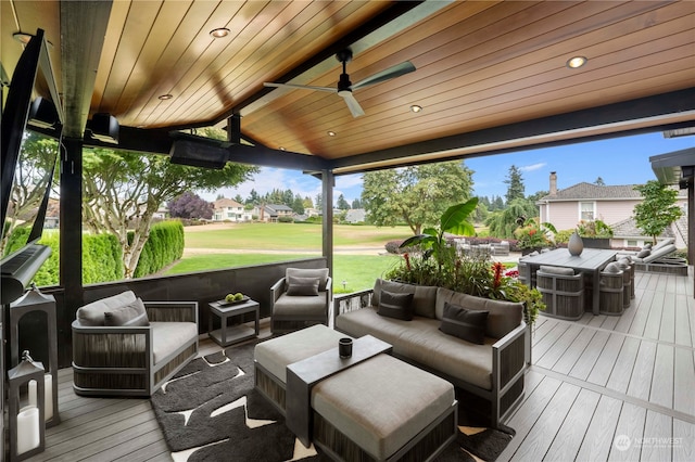 wooden deck with ceiling fan and an outdoor hangout area