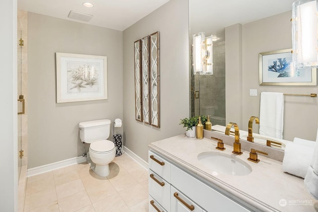 bathroom with toilet, vanity, baseboards, a shower stall, and tile patterned floors