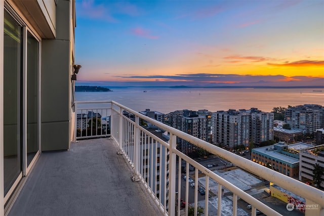 balcony at dusk with a water view