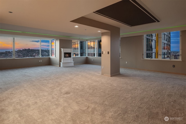 unfurnished living room featuring light colored carpet