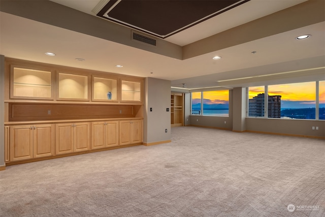 interior space featuring light colored carpet