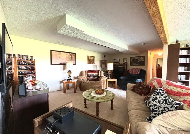 living room with a textured ceiling and carpet flooring