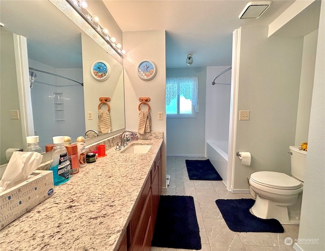 full bathroom featuring tile patterned floors, shower / bath combination, vanity, and toilet