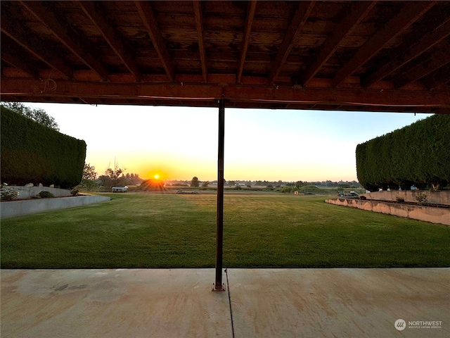 yard at dusk with a patio