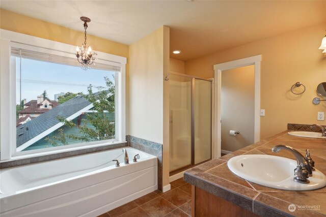 403 N I St, Tacoma, WA 98403 - bathroom featuring a shower stall, tile patterned floors, a garden tub, and a sink