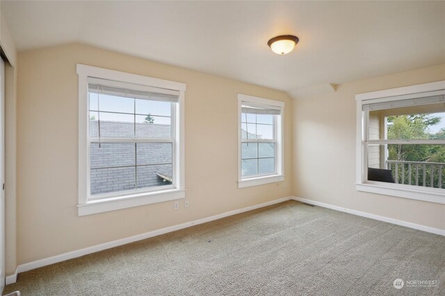 403 N I St, Tacoma, WA 98403 - carpeted empty room with baseboards and vaulted ceiling