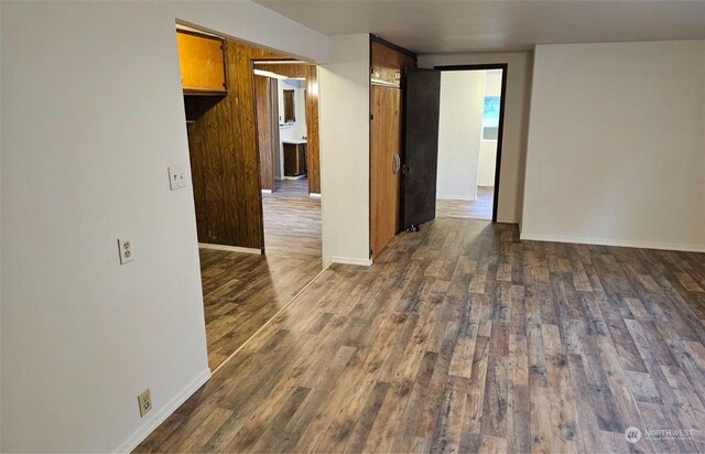 spare room featuring dark hardwood / wood-style flooring