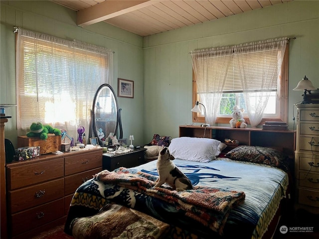 bedroom with beam ceiling