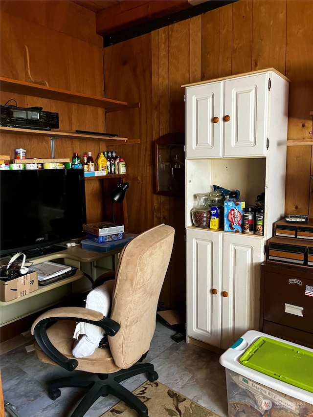 home office featuring wood walls