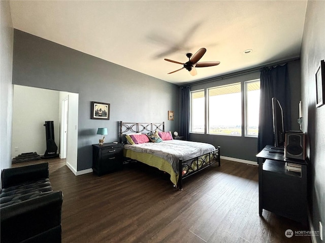 bedroom featuring ceiling fan and dark wood-type flooring