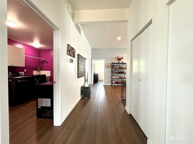 corridor with dark wood-type flooring