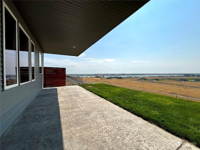 view of patio / terrace with a rural view