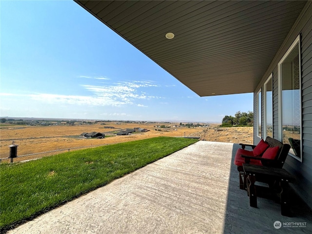 view of patio / terrace with a rural view