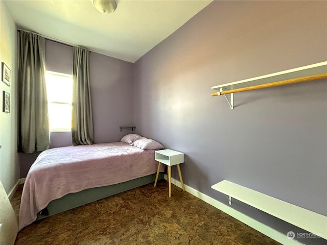 carpeted bedroom featuring vaulted ceiling