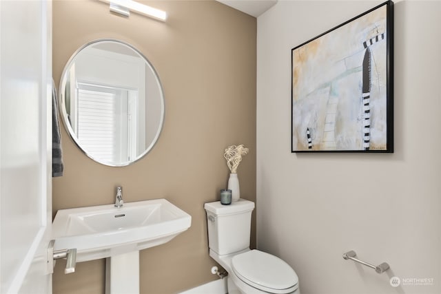 bathroom with sink and toilet