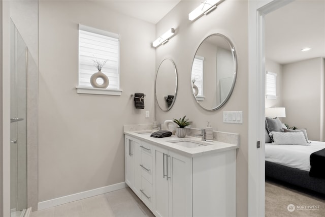 bathroom featuring tile patterned flooring and vanity