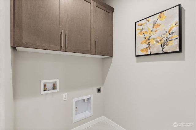 laundry room featuring cabinets, washer hookup, and hookup for an electric dryer