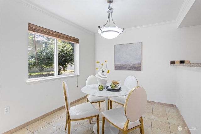 dining space featuring crown molding and light tile patterned floors