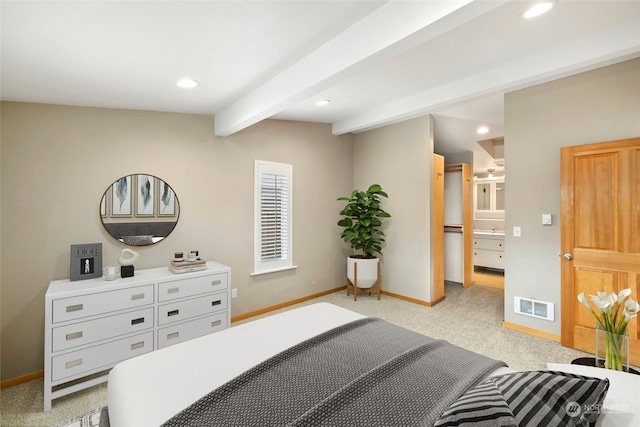 bedroom featuring vaulted ceiling with beams, light colored carpet, and connected bathroom