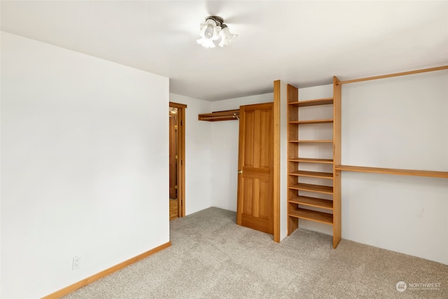 unfurnished bedroom with light carpet