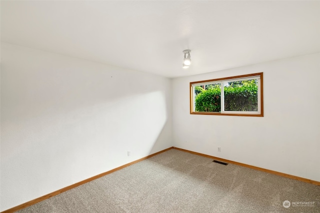 empty room featuring carpet flooring