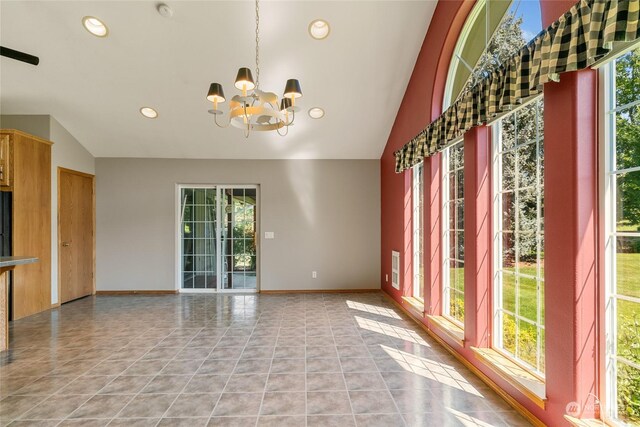 spare room with light tile patterned floors, vaulted ceiling, a notable chandelier, and recessed lighting