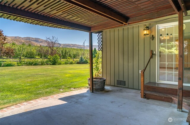 view of patio featuring entry steps and a mountain view