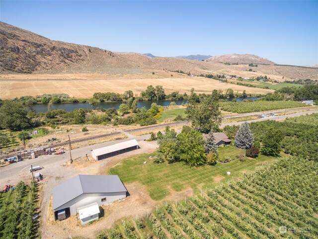 aerial view with a rural view and a water and mountain view