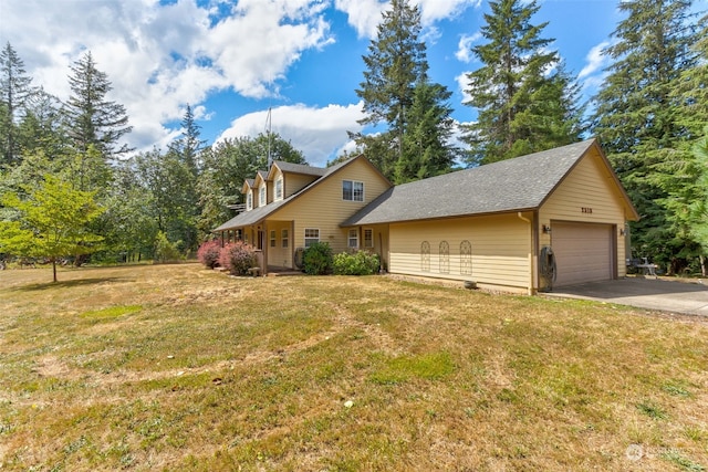 view of front of home with a garage and a front yard