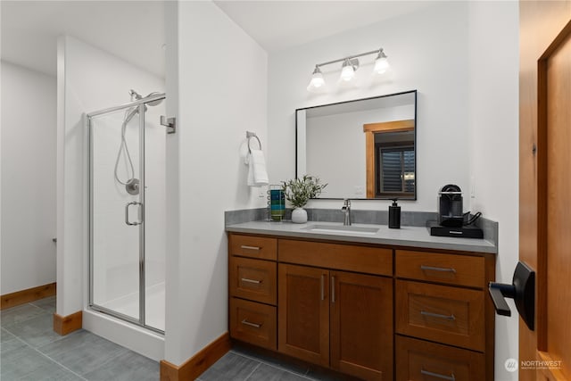 bathroom featuring vanity, an enclosed shower, and tile patterned floors