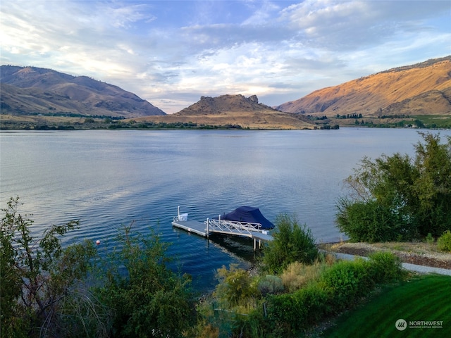 dock area with a water and mountain view