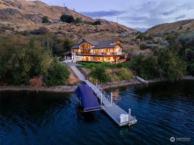 view of dock with a deck with water view