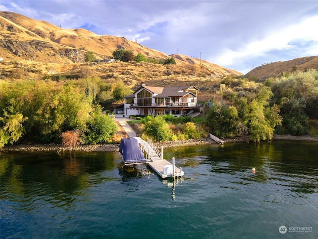 exterior space featuring a mountain view and a dock