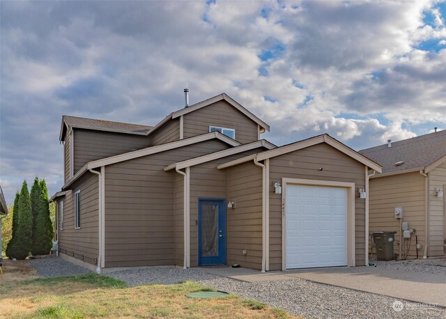 view of front of property with a garage