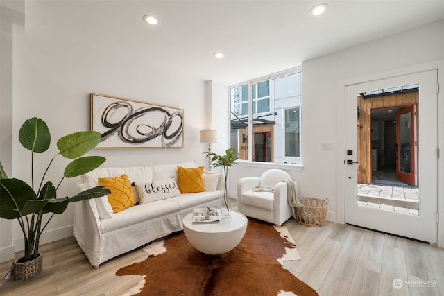 sitting room with light hardwood / wood-style flooring