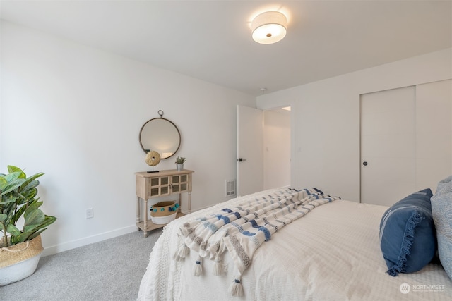 carpeted bedroom featuring a closet