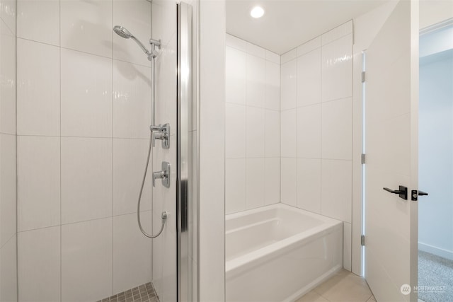 bathroom featuring shower with separate bathtub and tile patterned floors