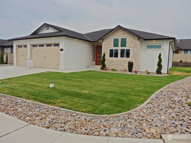 ranch-style home featuring a front yard and a garage