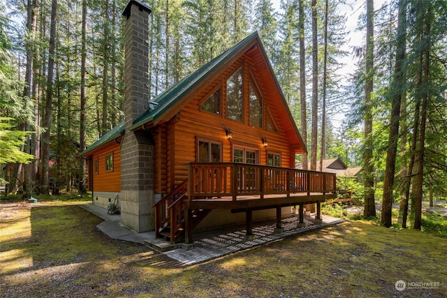 back of property featuring a wooden deck