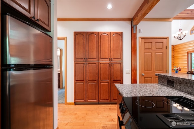 kitchen featuring a notable chandelier, stainless steel refrigerator, beamed ceiling, range with electric stovetop, and light wood-type flooring