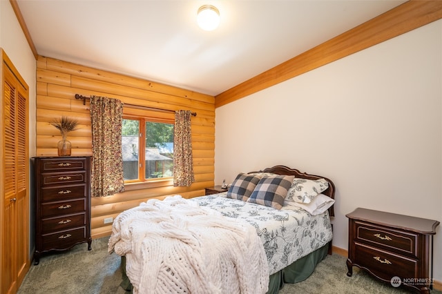 carpeted bedroom featuring rustic walls and a closet