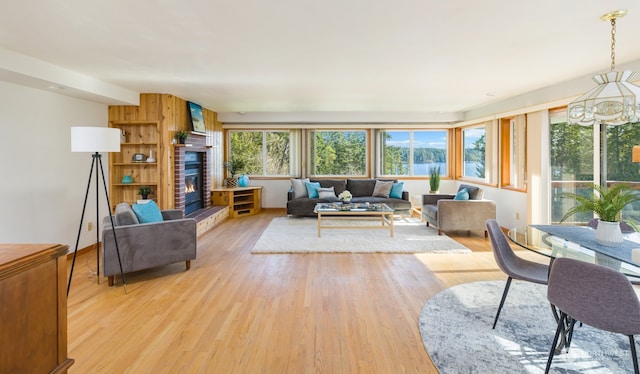 living room featuring light hardwood / wood-style flooring and a chandelier