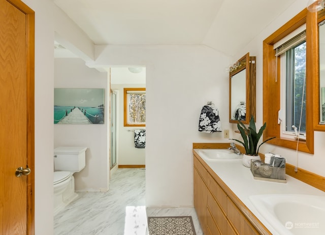 bathroom with toilet, dual bowl vanity, and tile patterned floors